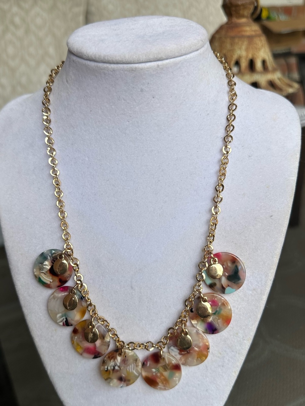 Gold-tone chain necklace with multi-color acrylic round stone dangles